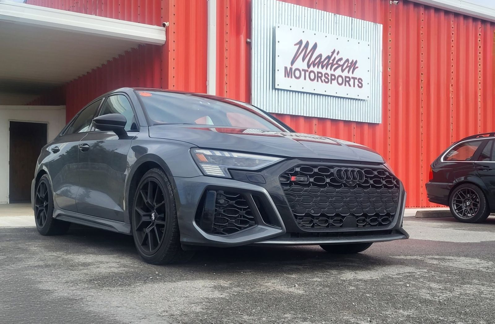 Audi RS3 in front of the Madison Motorsports sign
