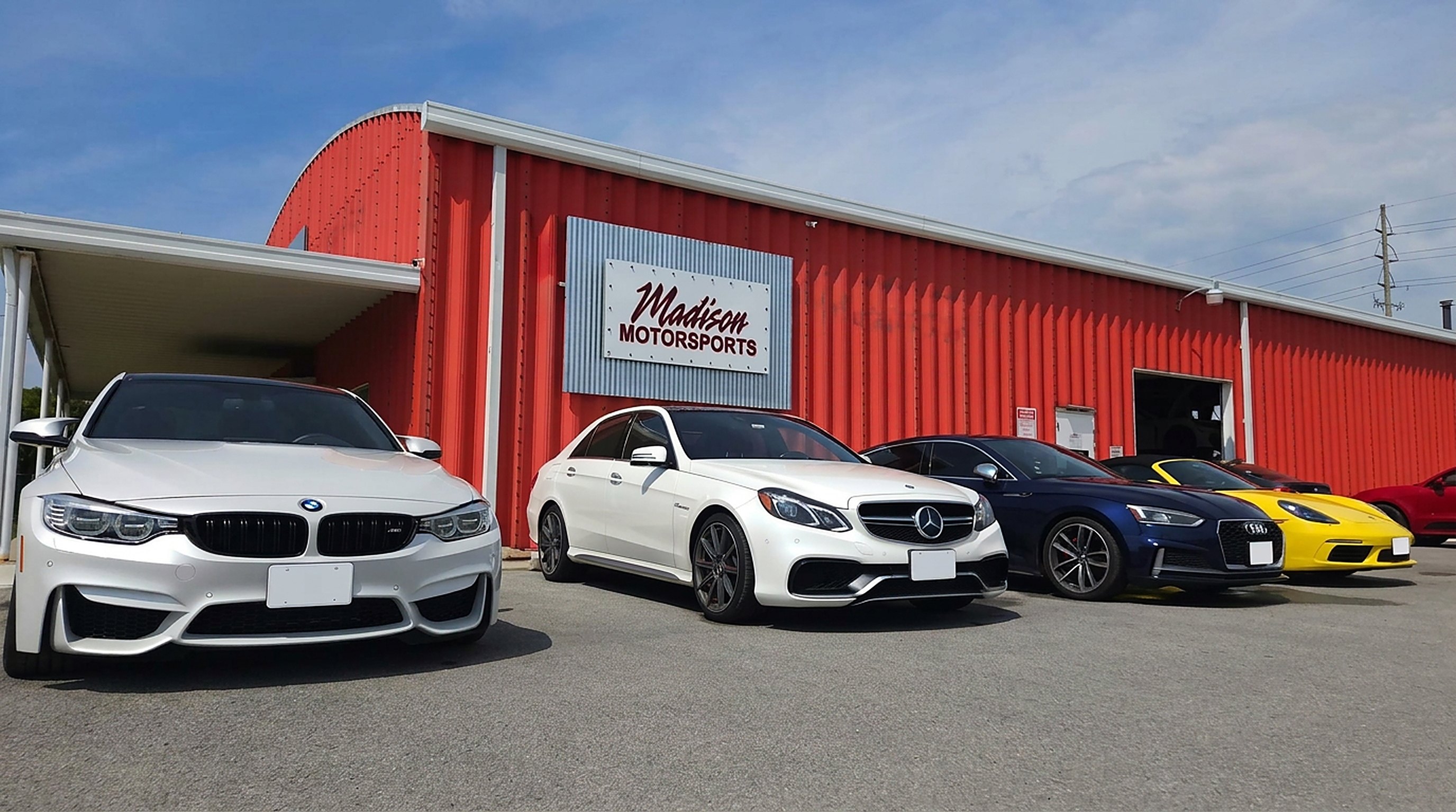 BMW M3, Mercedes E63, Audi and Porsche in front of Madison Motorsports